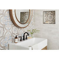 Thumbnail image of Bathroom vanity area with tiled walls and niche. Neutral tones with a blue accent is the color pallet using both square and rectangular tiles.  Pattern is used on accent wall and as added detail in niche.