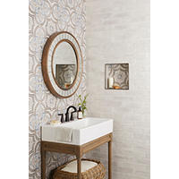Thumbnail image of Area features an accent wall any decorative floor and wall tile and giving flair to back of recessed niche use for both storage and decorative purposes both walls are featuring tile that is stacked and staggered and have white grout niche features in Dark Stainless Steel Somerset tile trim piece vanity is trash sink with eight would stand additional storage underneath. 
