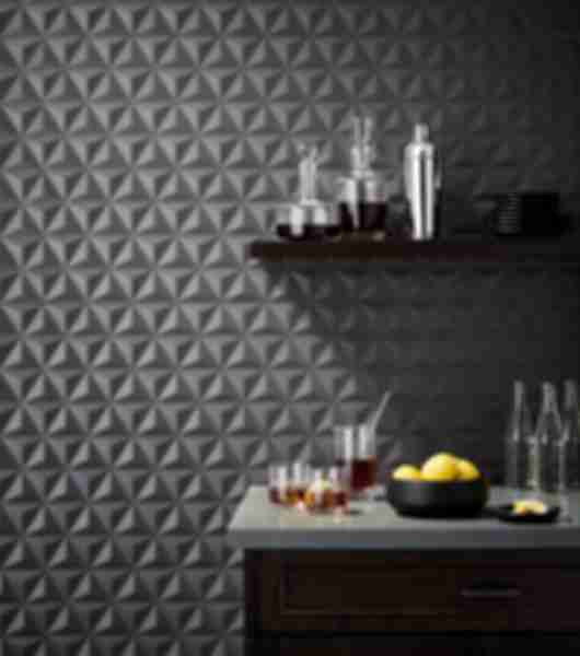 Contemporary bar with dark grey geometric 3-d tile.