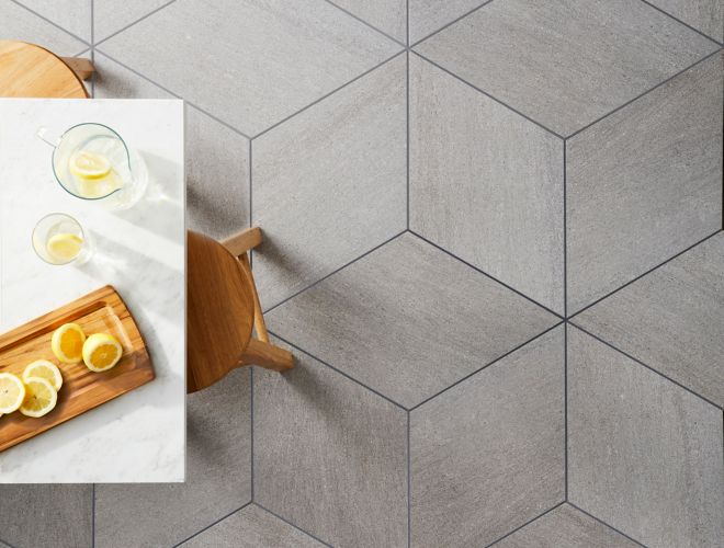 Geometric grey diamond porcelain floor tile dining room.