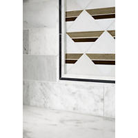 Thumbnail image of This mosaic wall tile combines geometric design with clean, classic colors. Framed in natural stone profiles transitioning to white marble tile to finish the space. 