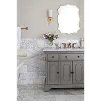 Thumbnail image of Bathroom vanity area with wainscoting and flooring in natural marble with polished finish and displays a cloudy white base with gold veining. 
