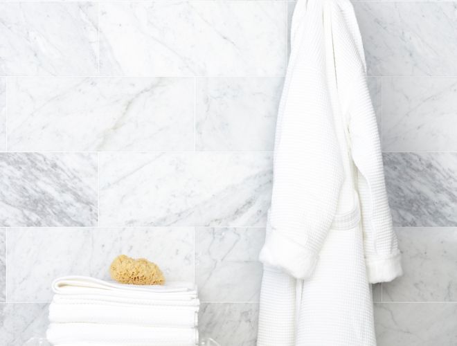 White marble wall with hanging robe.