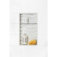 Thumbnail image of White tiled shower wall with recessed shelf. 