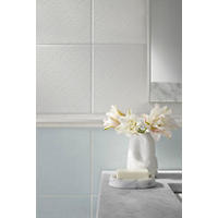 Thumbnail image of Bathroom area focused on vanity area with tiled walls.  Soft blue whites and greys are used in both ceramic and marble alike. 