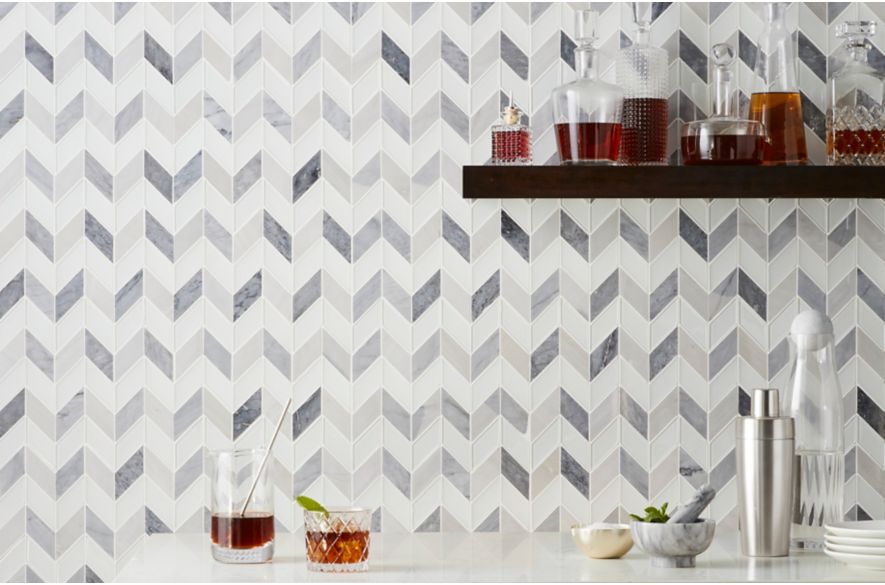 Grey and white chevron marble bar backsplash. 