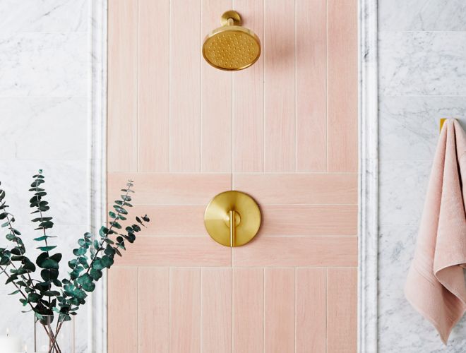 Scandinavian Chic shower with pink wood-look tile and white marble.