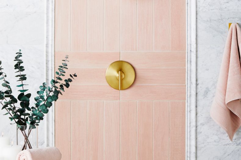 Scandinavian Chic shower with pink wood-look tile and white marble.