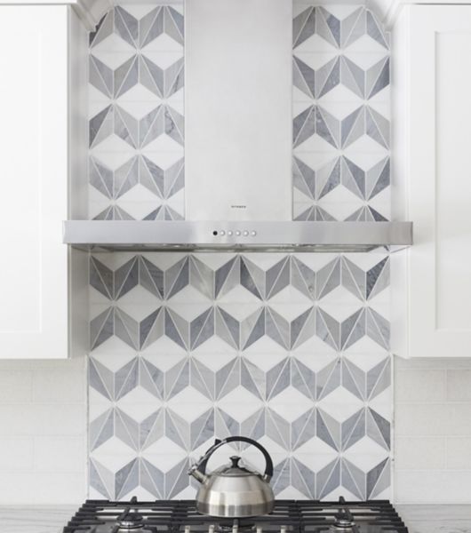 White and grey tile in a pattern kitchen stove backsplash.