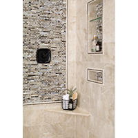 Thumbnail image of Natural (beige, white, taupe) marble walk in shower with a glass tile mosaic as the feature deco frame around the mixer and a back of niches all framed in matching marble and dark stainless profiles.  Floating bench adds function without sacrificing space.