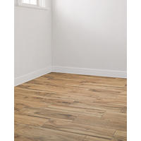 Thumbnail image of Room with focus on faux wood ceramic tile floor in staggered layout an warm beige tones.