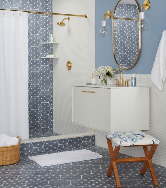 Bathroom with blue hexagon tiles and white penny tile