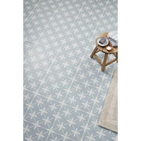 Thumbnail image of Overhead shot of floor a floor area using a matte porcelain tile features an intricate and unique geometric pattern in soft blue hues. .  