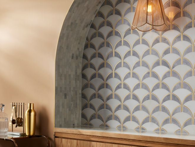 This art deco bar area features a geometric arch-shaped mosaic tile.