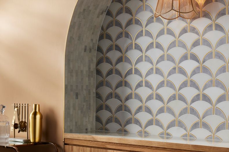 This art deco bar area features a geometric arch-shaped mosaic tile.