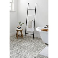 Thumbnail image of The off white background highlights the artistry of the taupe pattern in each tile. Four pieces of the tile make an unique pattern as seen in this Bathroom floor image.