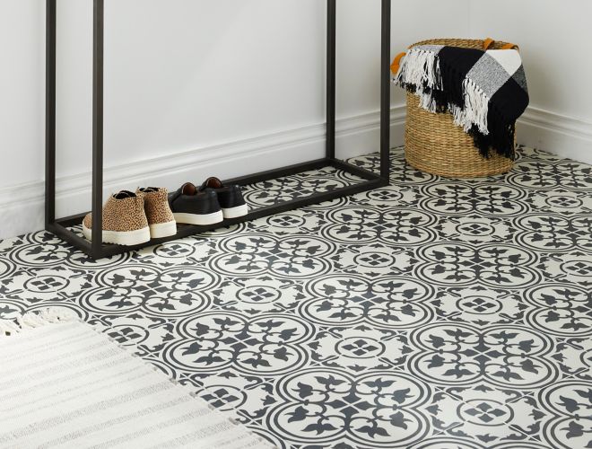 The off white background highlights the artistry of the charcoal pattern in each tile. Four pieces of the tile make an unique pattern as seen in this entry.