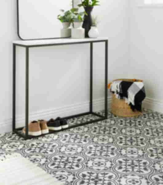 The off white background highlights the artistry of the charcoal pattern in each tile. Four pieces of the tile make an unique pattern as seen in this entry.