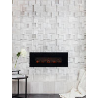 Thumbnail image of Raised tile fireplace with limestone on hearth and face.  A  charcoal toned man-made tile used for the rooms floor with Patterned area rug and side table.