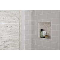 Thumbnail image of Shower walls with ceramic subway tile. Niche and deco in neutral marble.  Profiles are marble and glass.