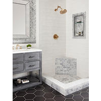 Thumbnail image of Bathroom is tiled with black hexagon on floor, marble base and profiles frame niche and duel as wainscot border.  Chevron accents in niche and on vanity wall. Small brick patterned marble is on bench front and  small hex is in shower pan. Color scheme black white and grey. 