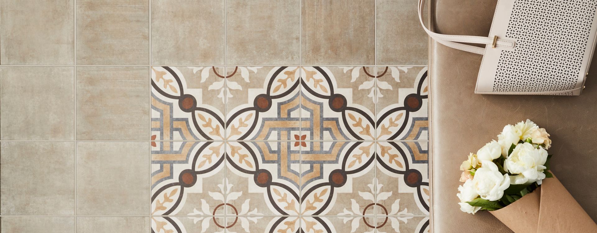 Brown and Tan Patterned Tile Entryway. 