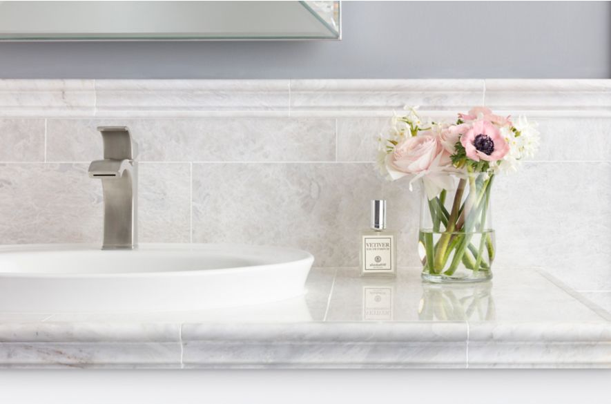 ceramic tiles surrounded wash basin.