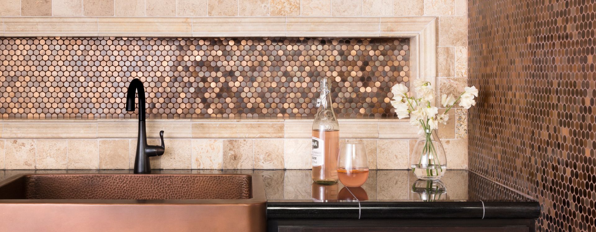 Kitchen backsplash with copper metallic tile.