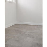 Thumbnail image of Floor tile in soft silvery, dark grey, tan and taupe tones laid out in staggered pattern. 