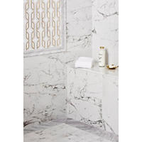 Thumbnail image of Walk in shower with marble look wall and floor tile.  Decorative art deco look mosaic with metallic accents in frame bordered with marble profiles.