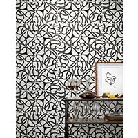 Thumbnail image of A modern art inspired mosaic made of marble creates an amazing accent wall for this area.  Tile is black and white to give a timeless look.