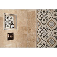 Thumbnail image of Close up of walk in shower wall with niche and framed deco. 