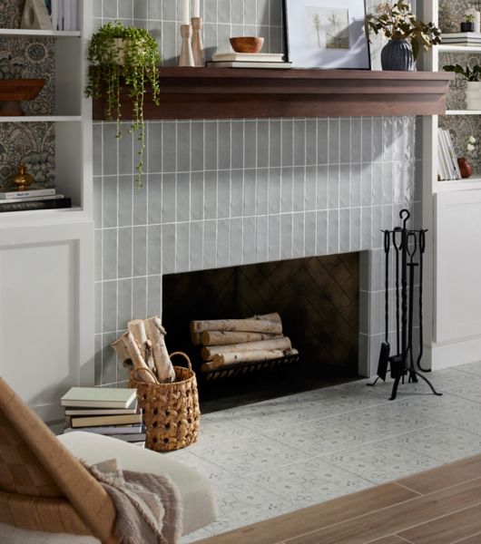 Living Room with a fireplace with Morris and Co. Hawkdale Pure Cloud Subway tile on the wall, Morris and Co. Pure Net Cloud Floor tile on the hearth, and Solna Natural Wood Look Floor Tile