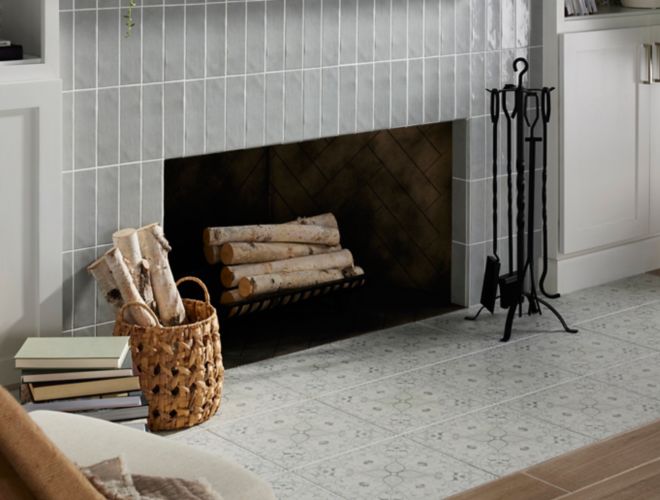 Living Room with a fireplace with Morris and Co. Hawkdale Pure Cloud Subway tile on the wall, Morris and Co. Pure Net Cloud Floor tile on the hearth, and Solna Natural Wood Look Floor Tile