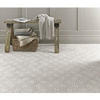 Thumbnail image of Photo focuses on floor tile in a fabric pattern in a dove grey with a lattice like print.