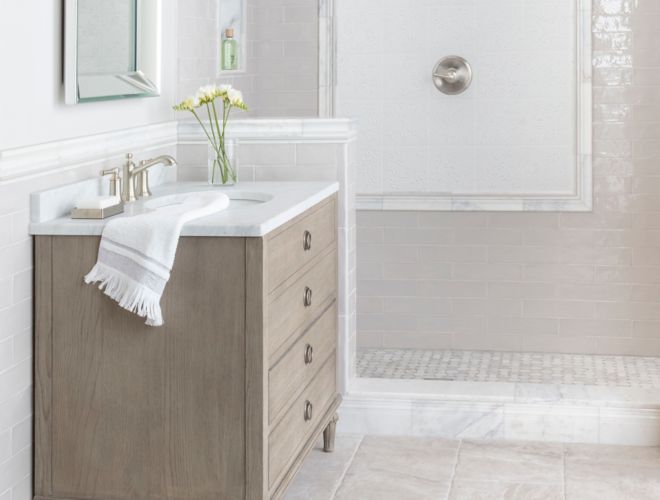 Bright and coastal bathroom with warm grey and white tile.