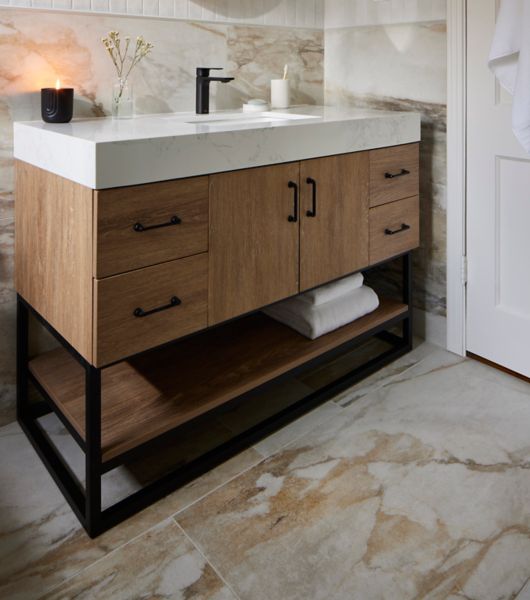 Bathroom with large-format marble-look porcelain tile floor.