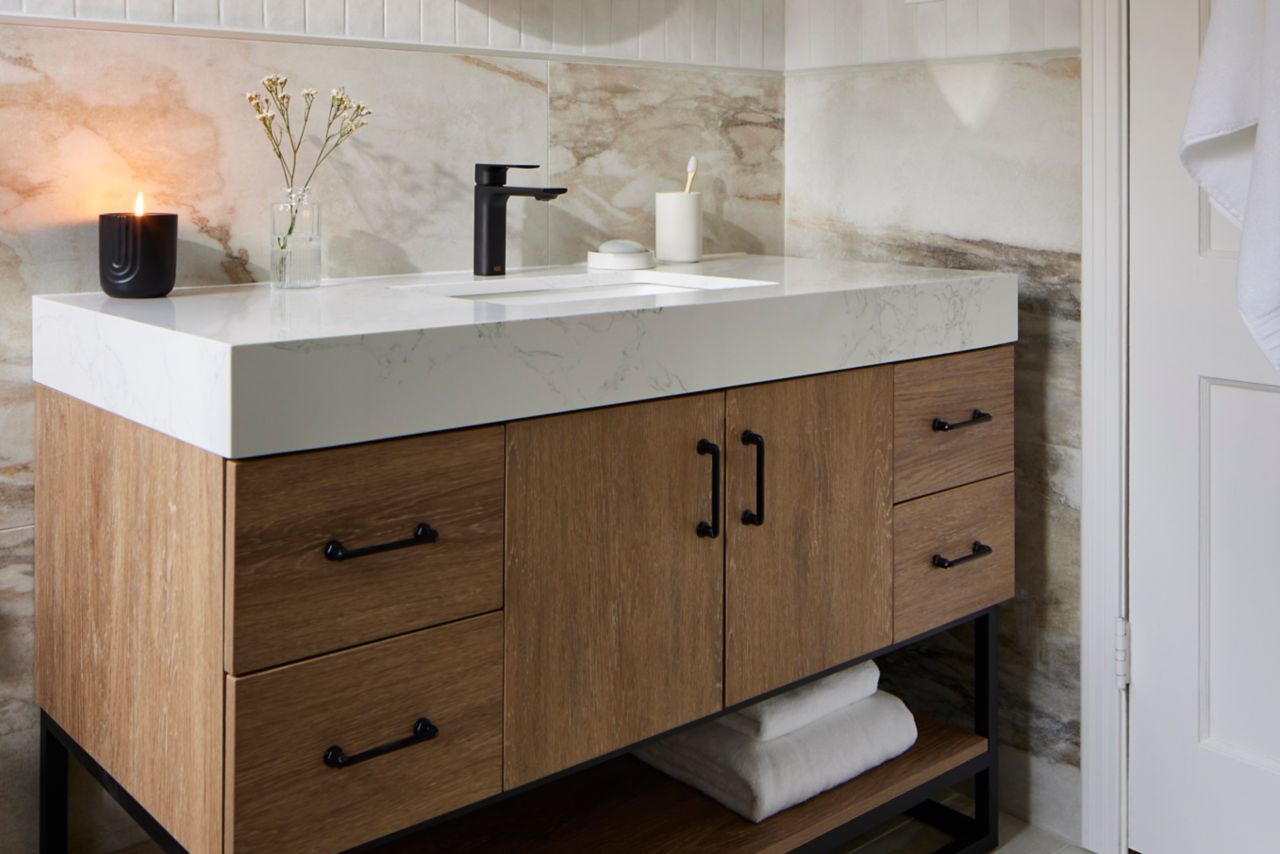 Bathroom with large-format marble-look porcelain tile floor.