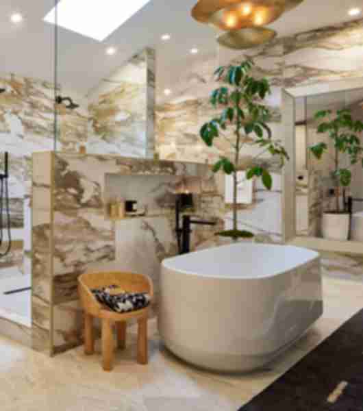White tile with bold brown veining in a bathroom