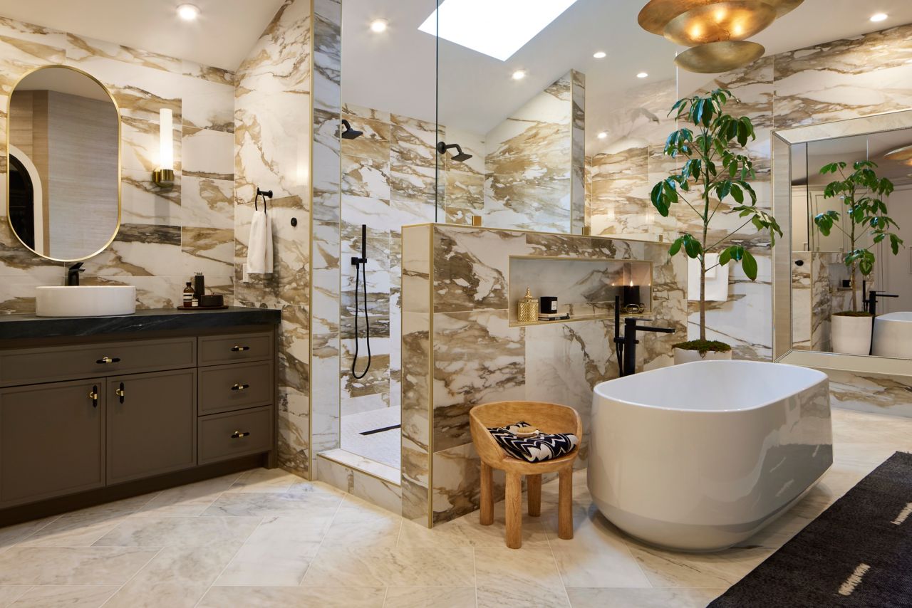 White tile with bold brown veining in a bathroom.