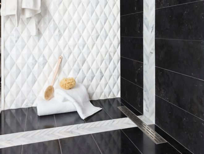 Black and whtie shower with 3-D diamond marble wall tile with black marble wall and floor tile.