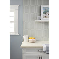 Thumbnail image of Kitchen backsplash with a vertical ran picket glossy tile above countertop.  White cabinet and black hardware.