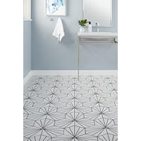 Thumbnail image of Bathroom with white hexagonal tile with black lines for a pattern.  Vanity and towel on wall with blue walls and white base board.