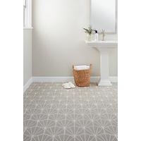 Thumbnail image of Bathroom with focus on hexagon floor tile lined with white for a pattern with in the tile.  White pedestal sink and wicker basket with slipper  and towels.