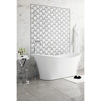 Thumbnail image of Soaker tub with side table. Grey floor tile and black and white marble look on will with accent frame of patterned tile.