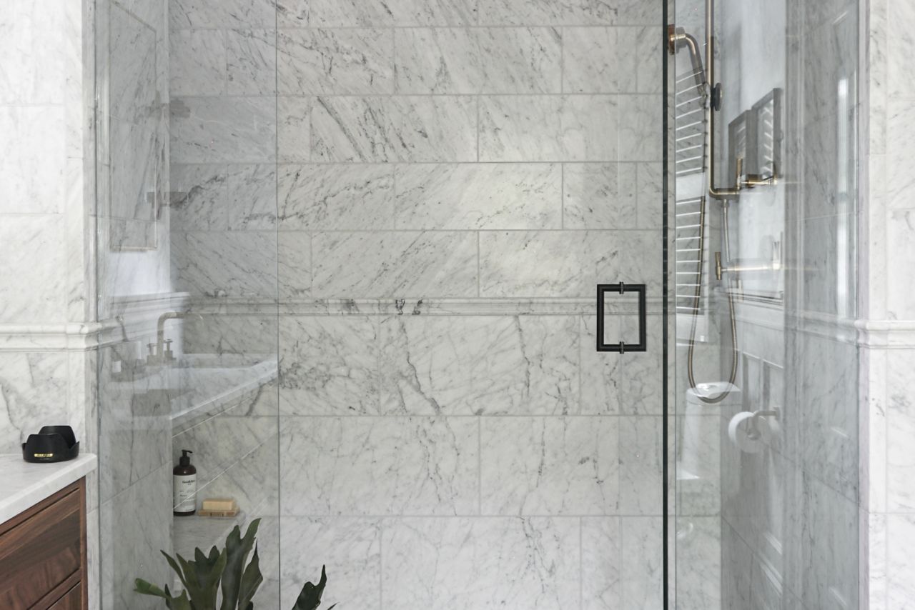 White with grey veining marble shower.