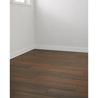Thumbnail image of Room scene featuring faux wood porcelain tile in brown and warm beige tones.