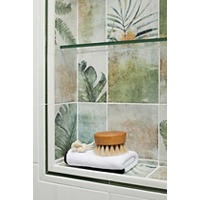 Thumbnail image of Shower wall natural stone and glass with porcelain in back of niche with leaf pattern.