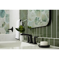 Thumbnail image of Hexagonal porcelain tile with green tones and floral print on wall. Green glass tile on backsplash.