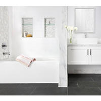 Thumbnail image of Bathroom with dark slate looking floor with marble and white ceramic walls and marble and glass accents.